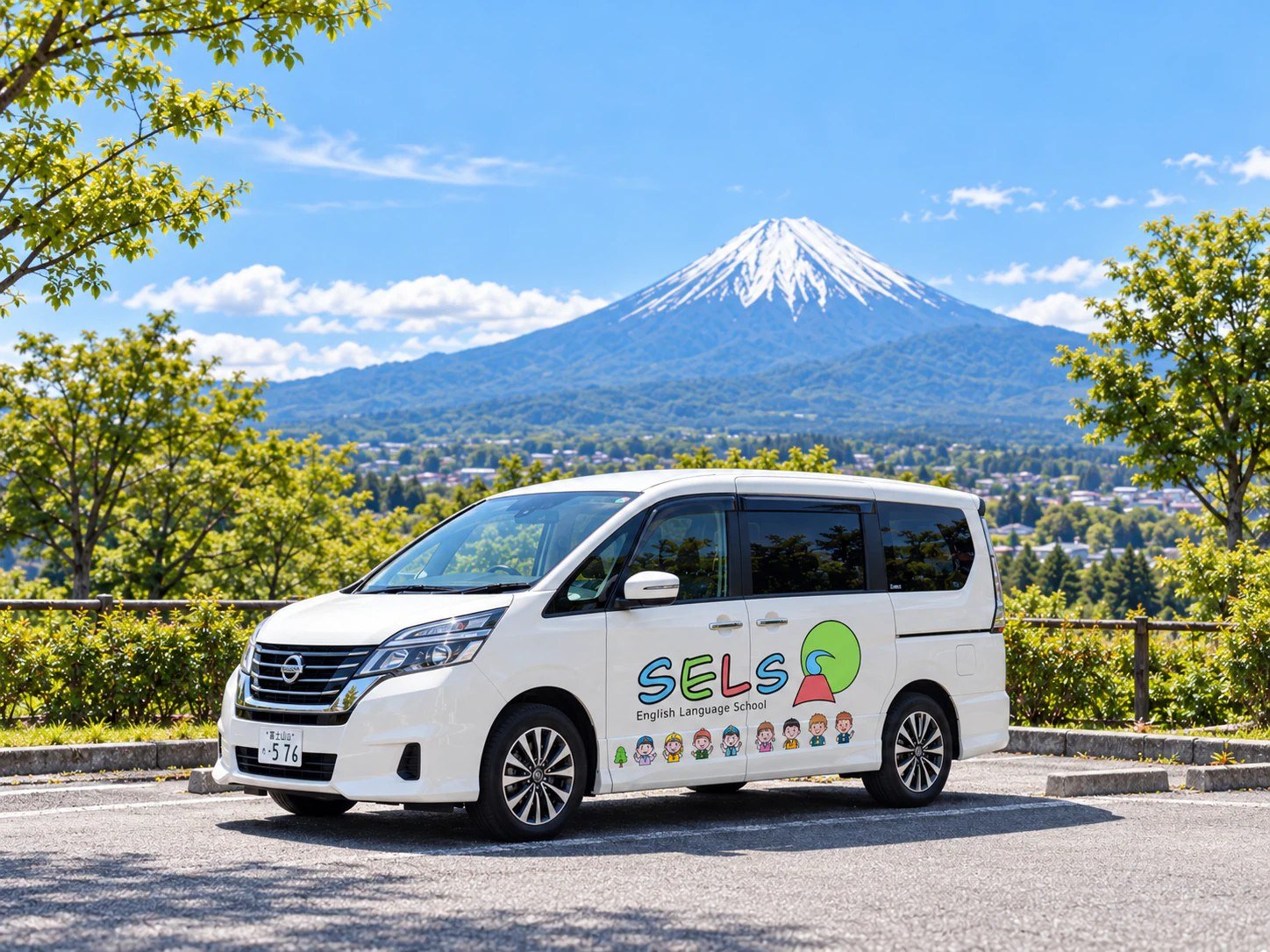 Image of a white SELS-branded shuttle van with Mount Fuji in the background.